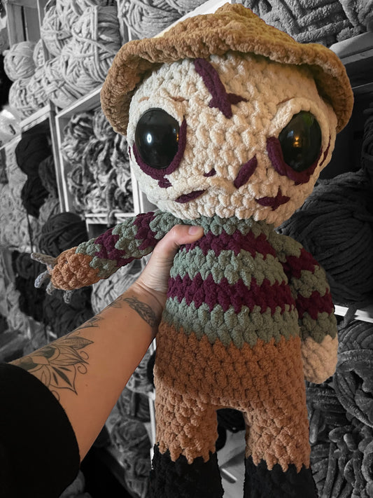 Cuddly Nightmare Slasher is perfect for any horror fans collection. He measures 18 inches tall and made with Blanket Yarn so hes super soft and great for cuddles !